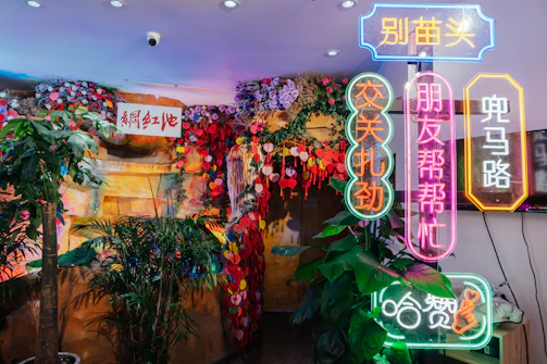 Restaurant interior decorated with vibrant, lifelike artificial plants