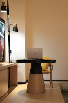 silver imac on brown wooden table