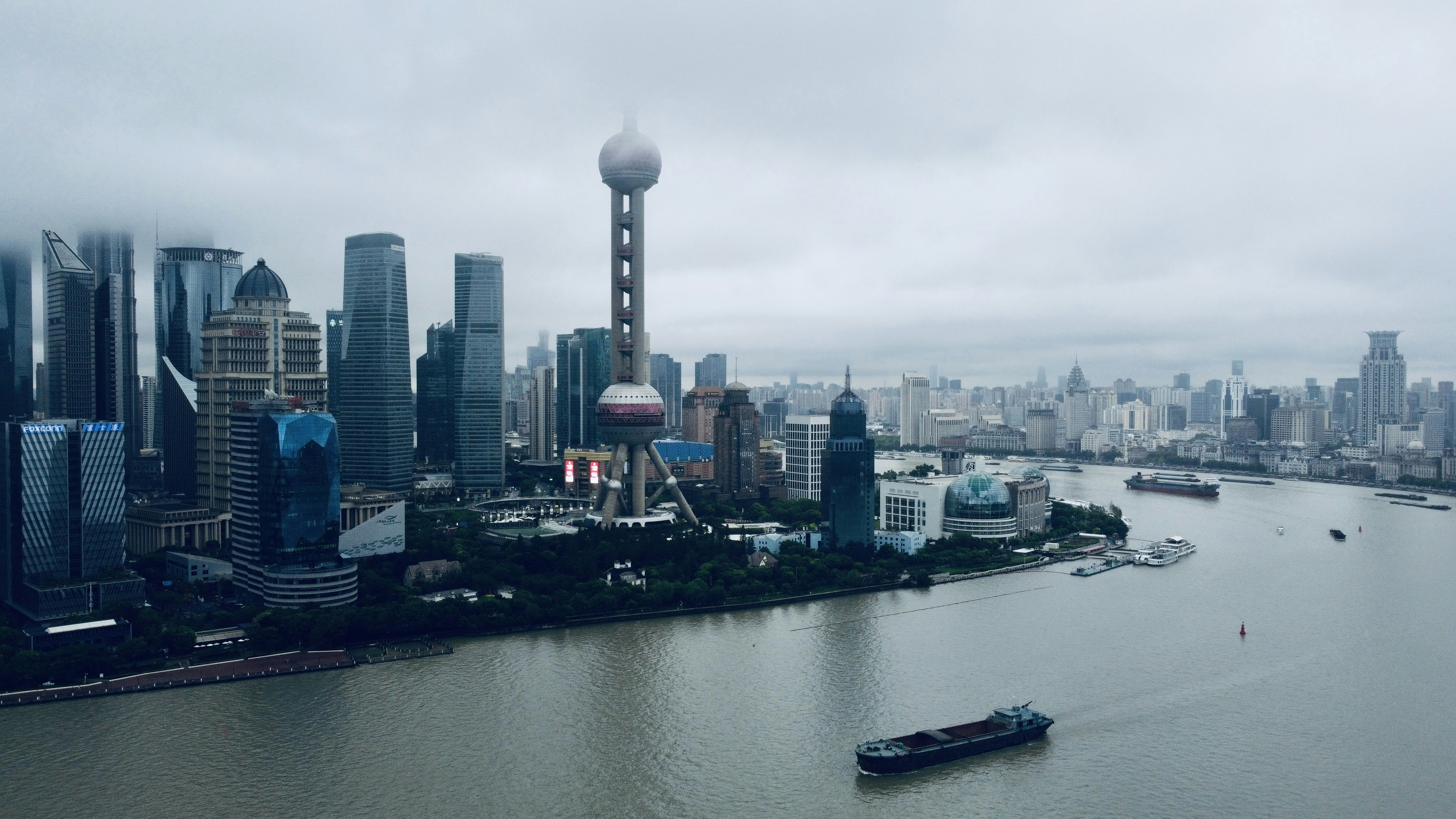 city skyline under white sky during daytime