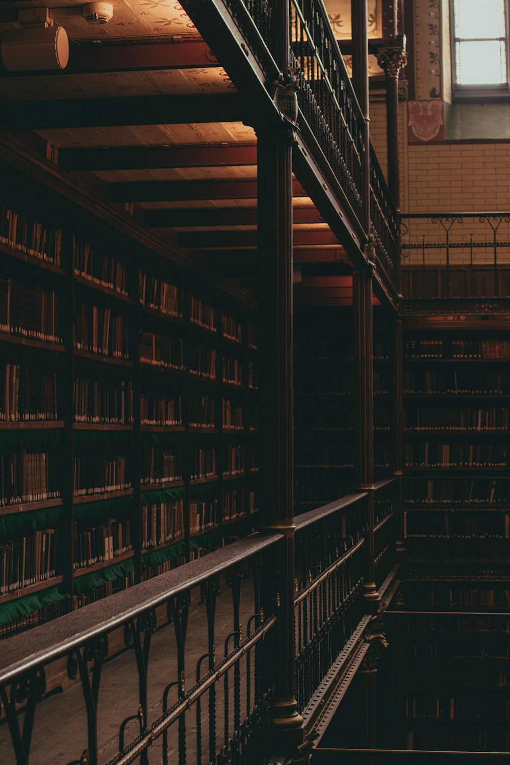 brown wooden shelves with books