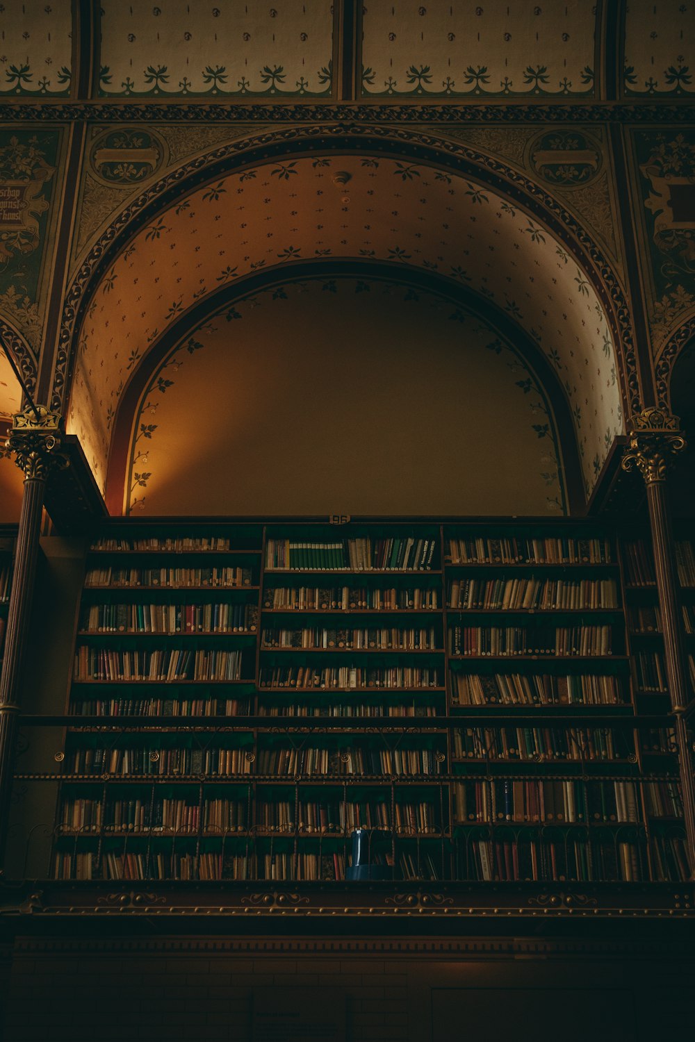 brown wooden book shelves with books