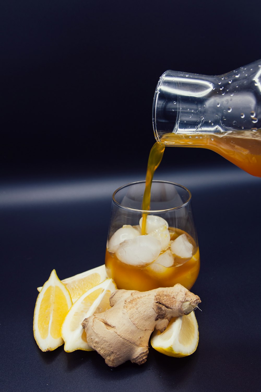 clear drinking glass with yellow liquid