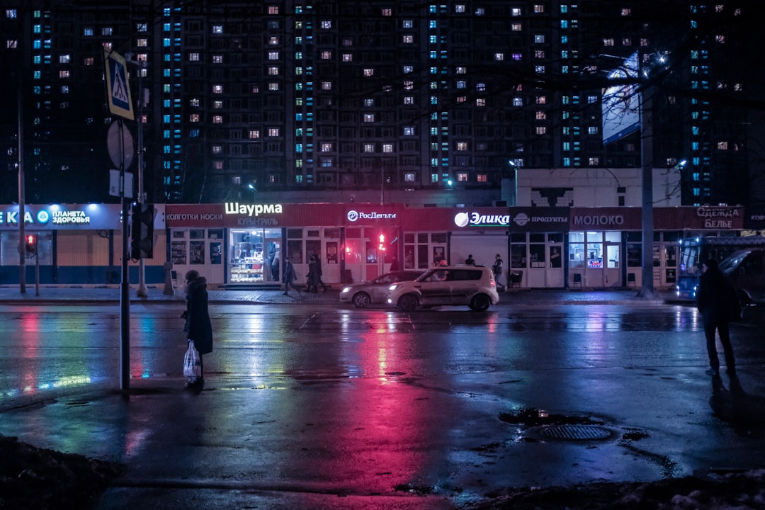 people walking on street during night time