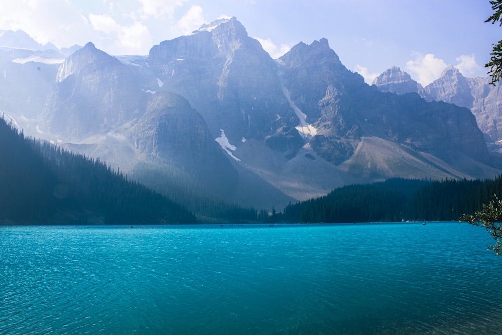 lake near mountain range during daytime