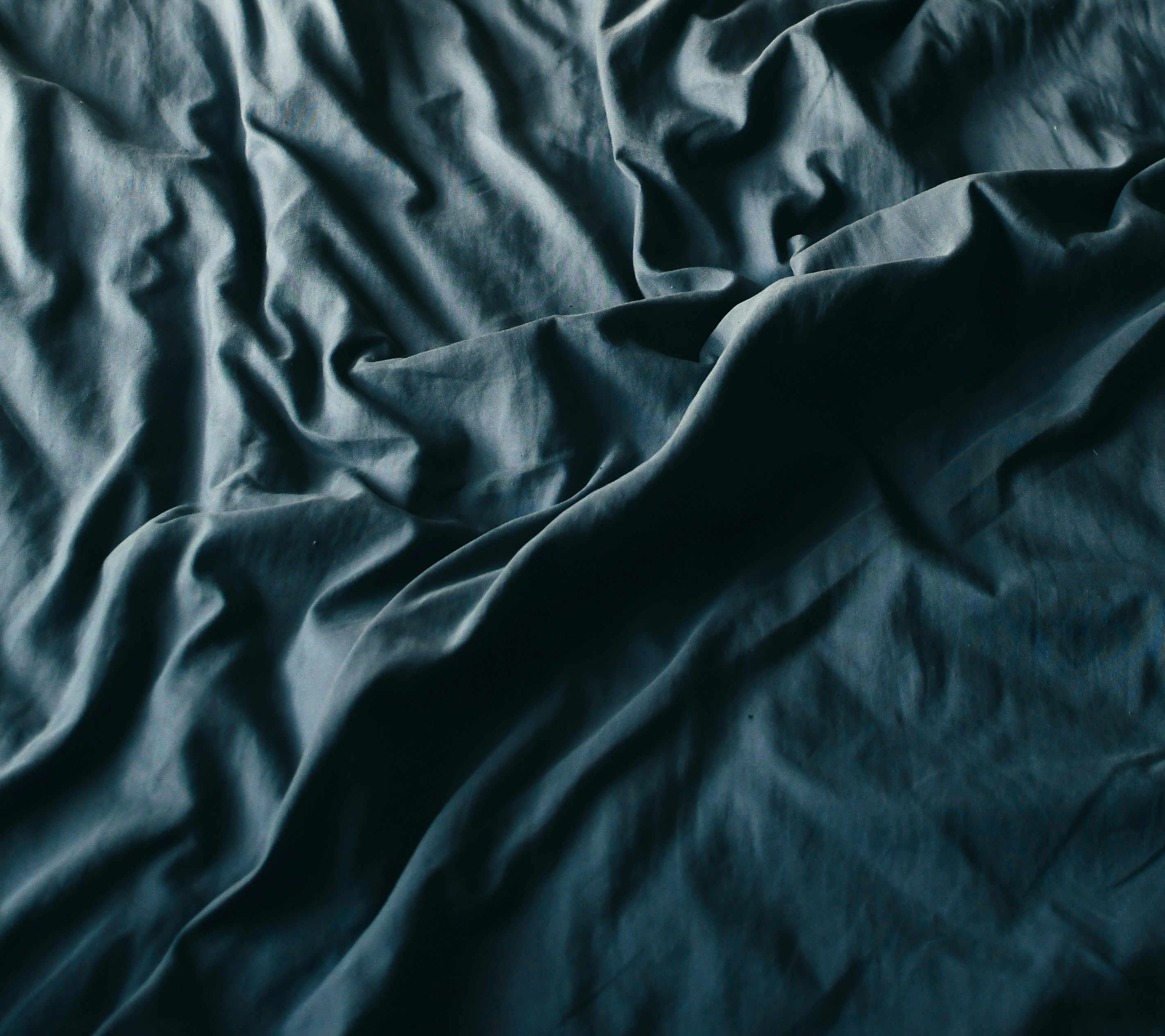 black textile on brown wooden table