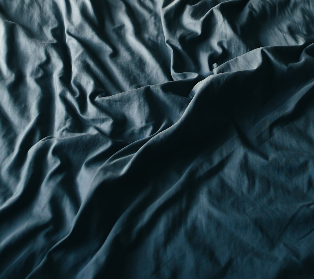 black textile on brown wooden table