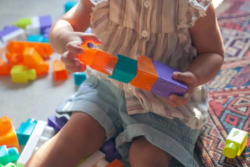 Toddler playing during a development check
