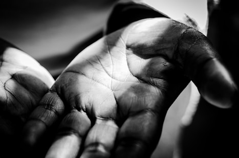 grayscale photo of persons hand
