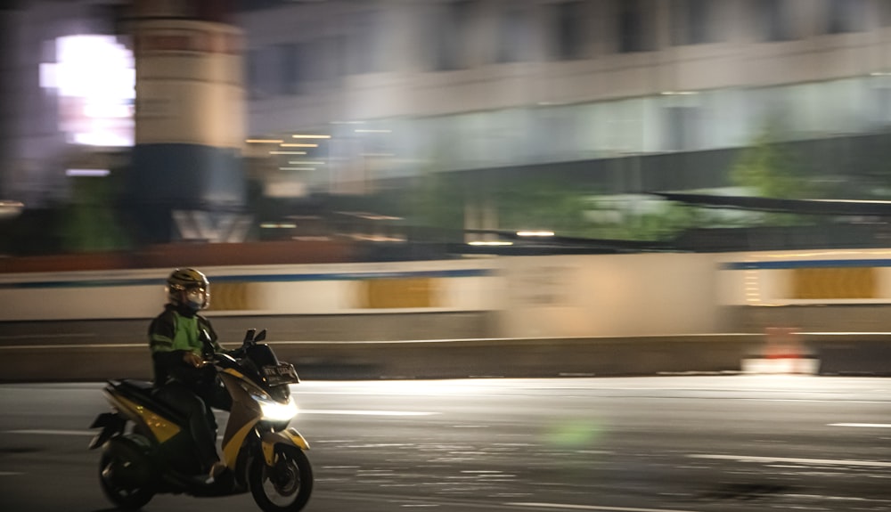 man riding motorcycle on road during daytime