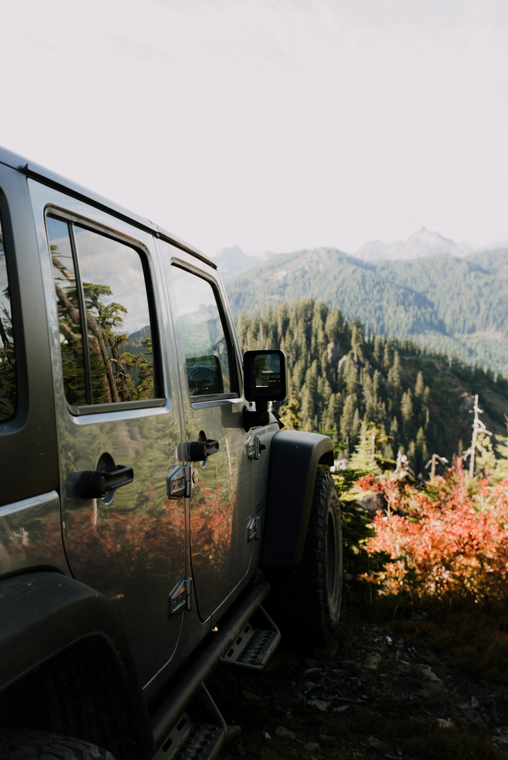 black suv on dirt road during daytime