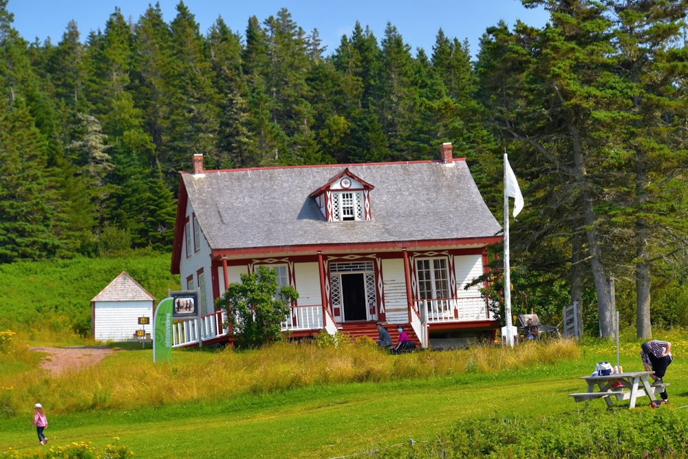 white and brown house on green grass field