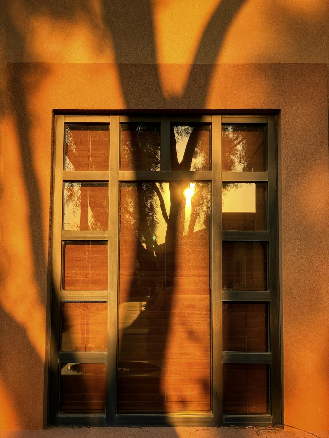 brown wooden framed glass window