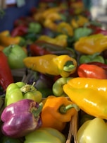 Organic bell peppers of various colors arranged beautifully.