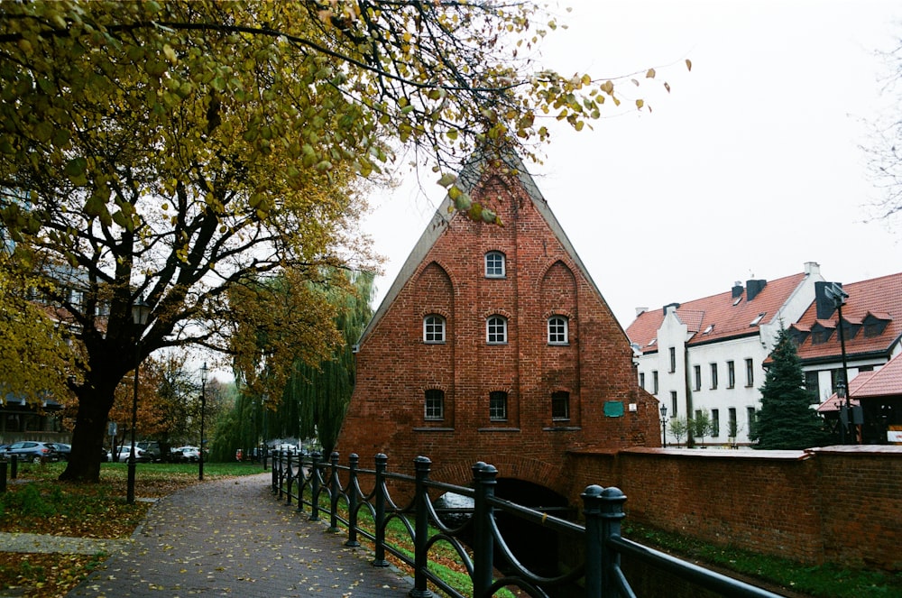brown brick building near green trees during daytime