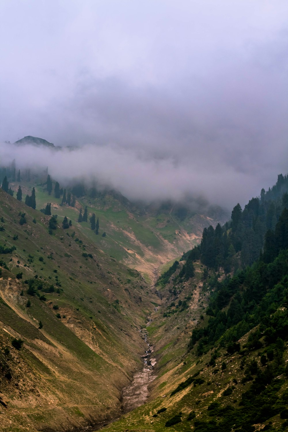 green mountains under white clouds during daytime