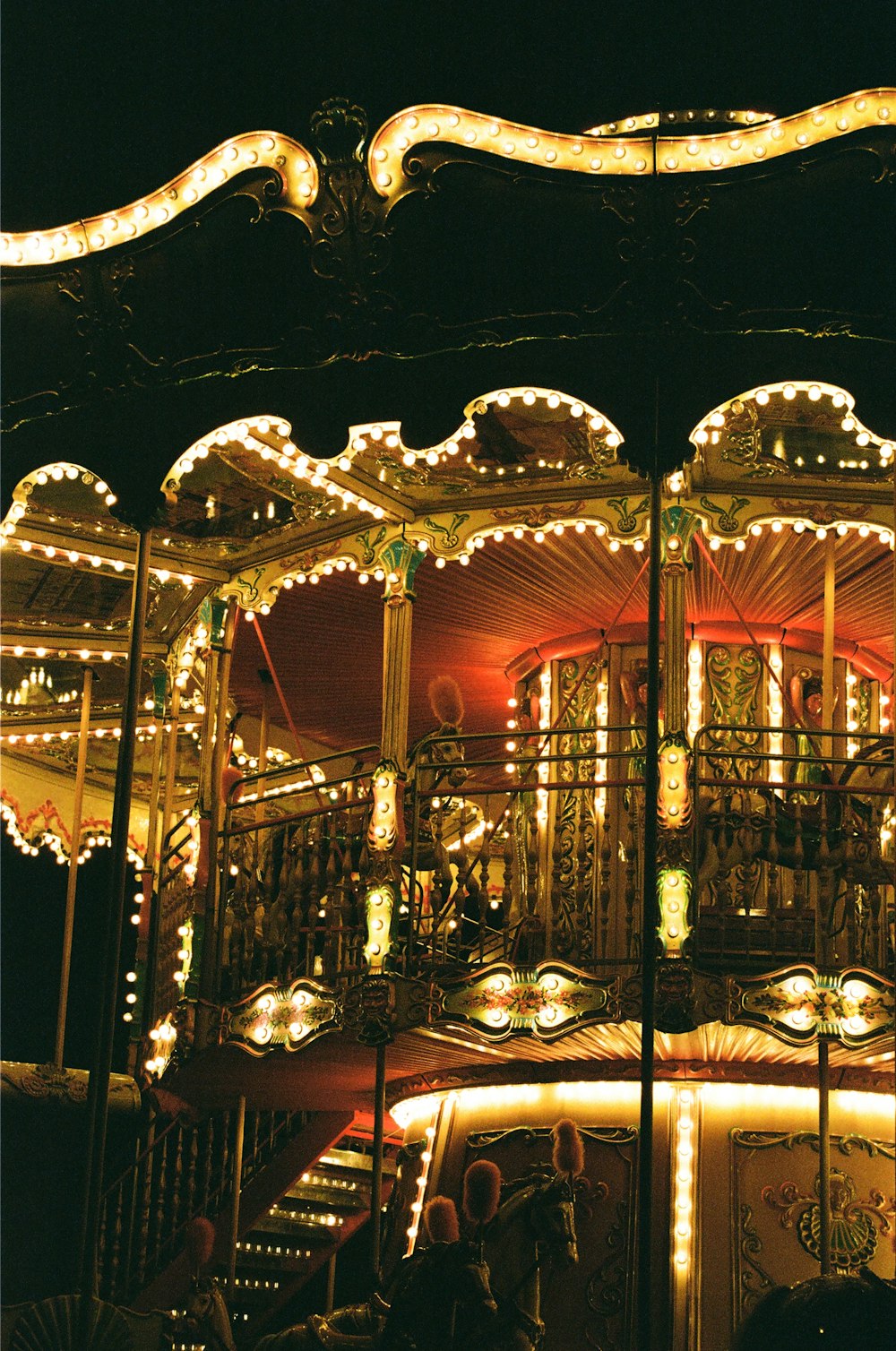 lighted carousel with lights turned on during night time