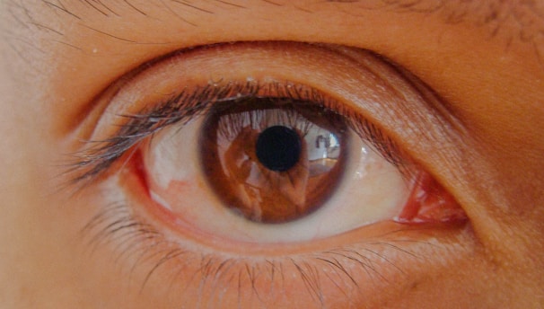 persons eye in close up photography