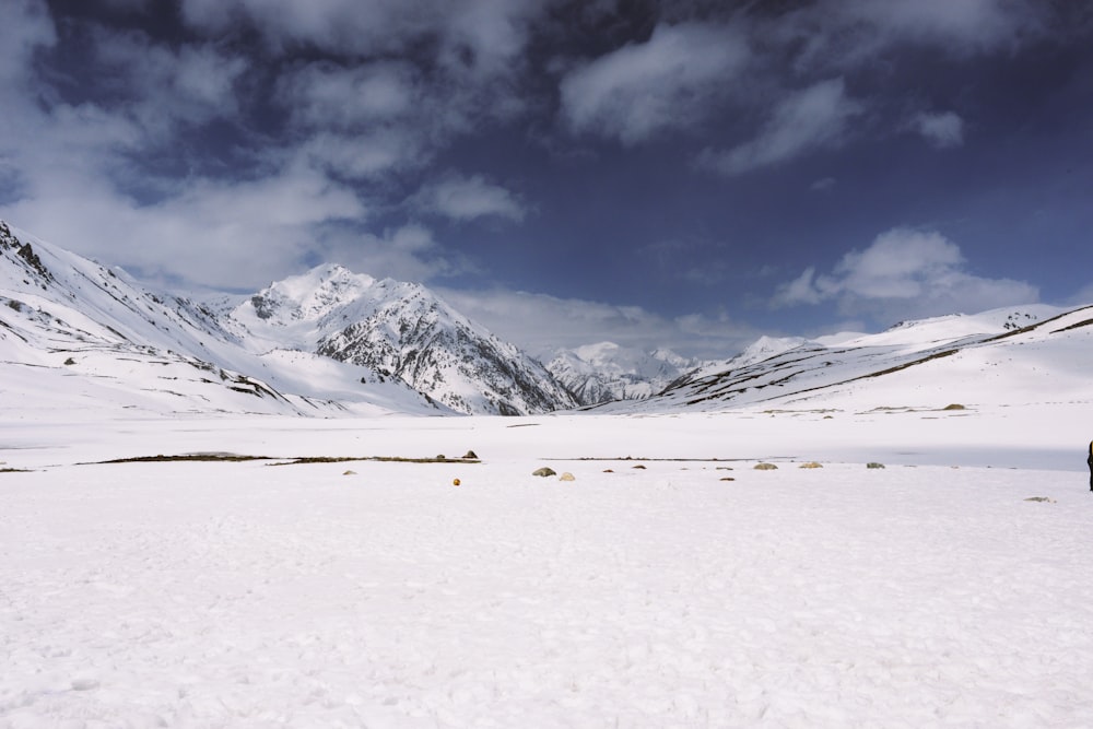 snow covered mountain under cloudy sky during daytime