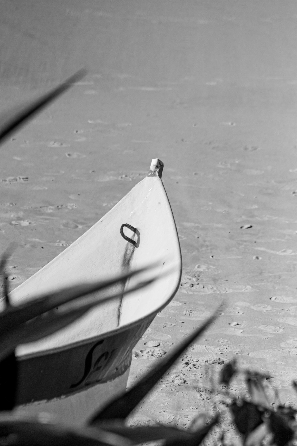 white umbrella on gray sand