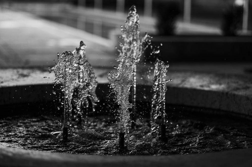 grayscale photo of water fountain