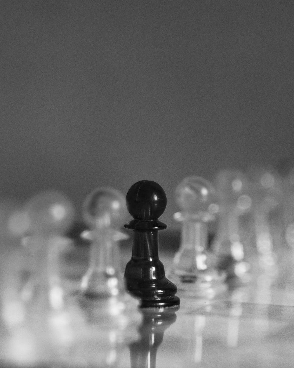 a black and white photo of a chess board