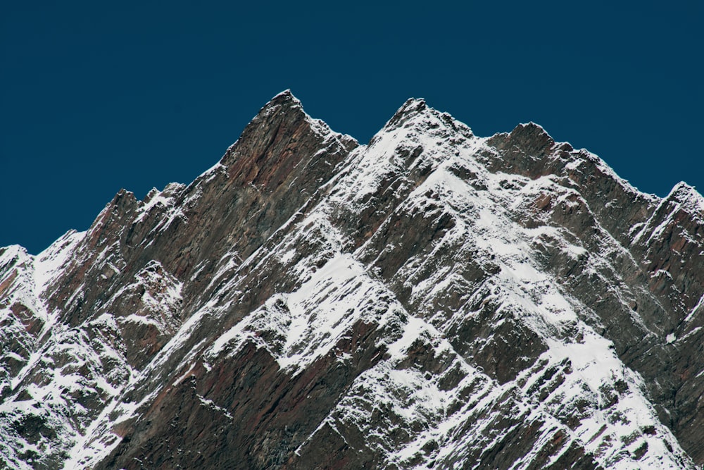 gray and white mountain under blue sky during daytime