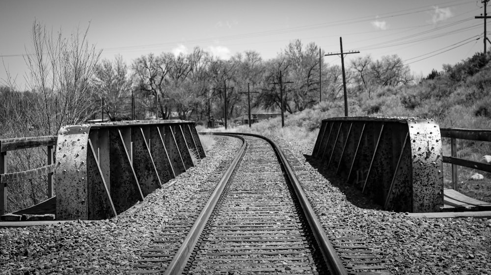 grayscale photo of train rail