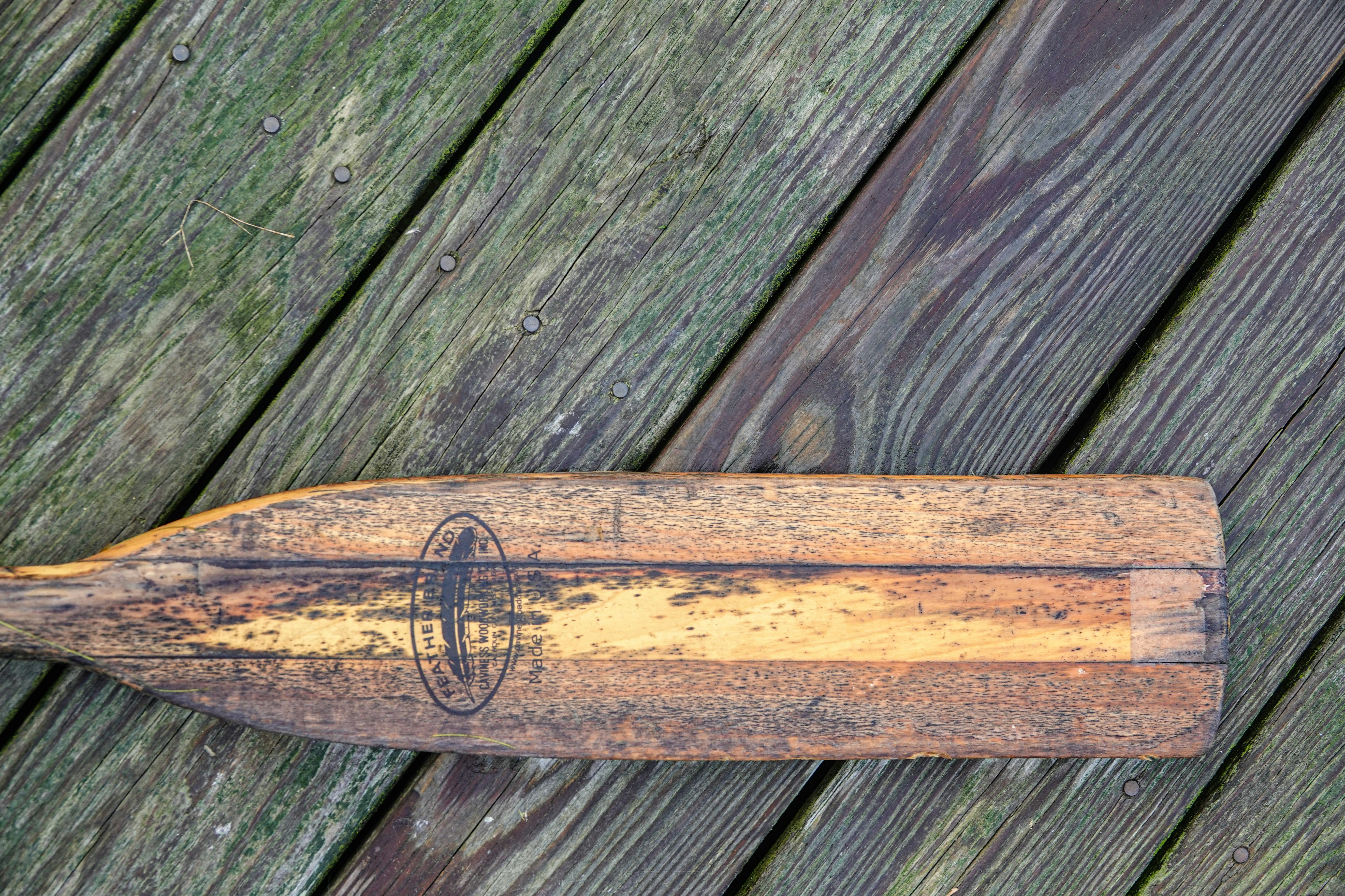 brown wooden stick on gray wooden plank