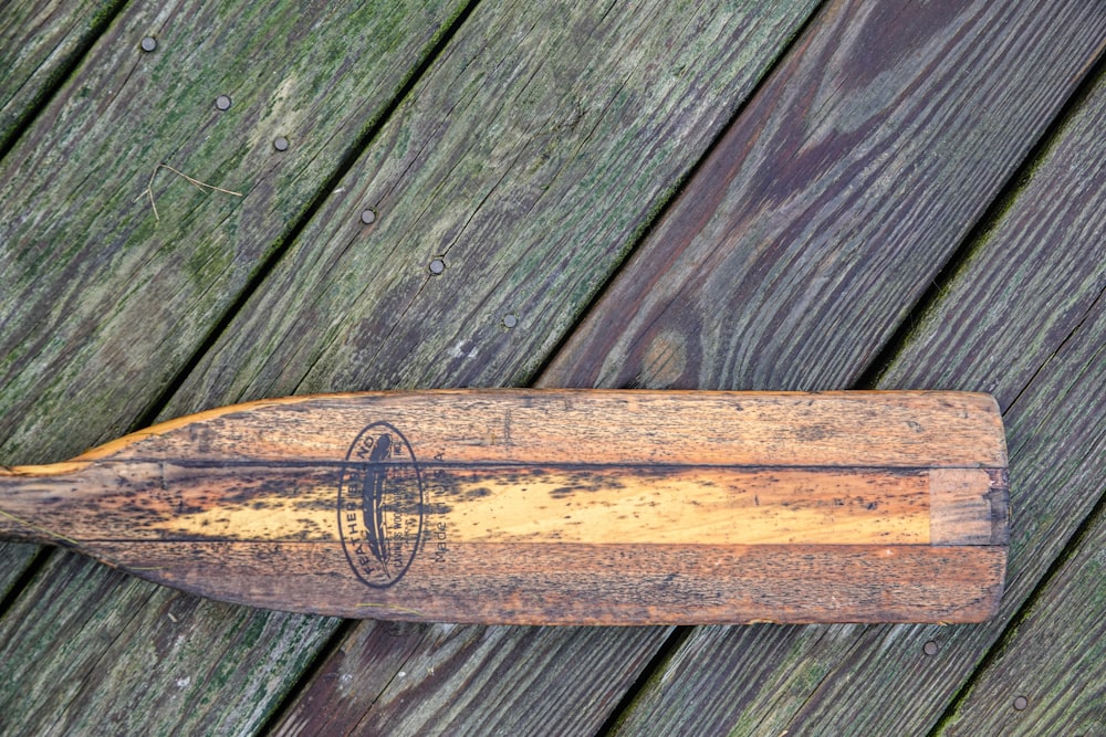 brown wooden stick on gray wooden plank