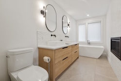white ceramic sink with stainless steel faucet