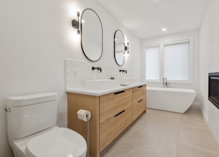 white ceramic sink with stainless steel faucet