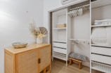 brown wooden bed frame with white bed mattress