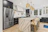 silver french door refrigerator beside white wooden table