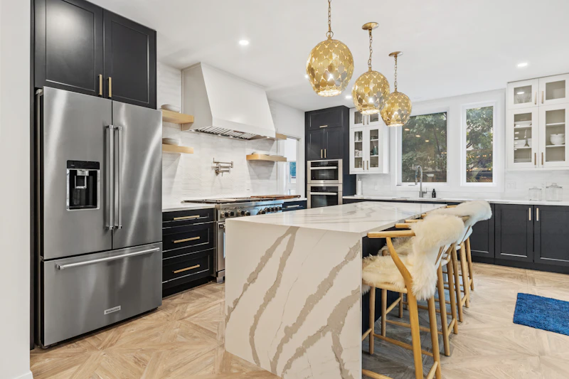 Navy kitchen with walnut shelves