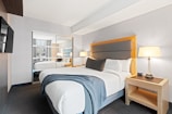 white bed linen on bed