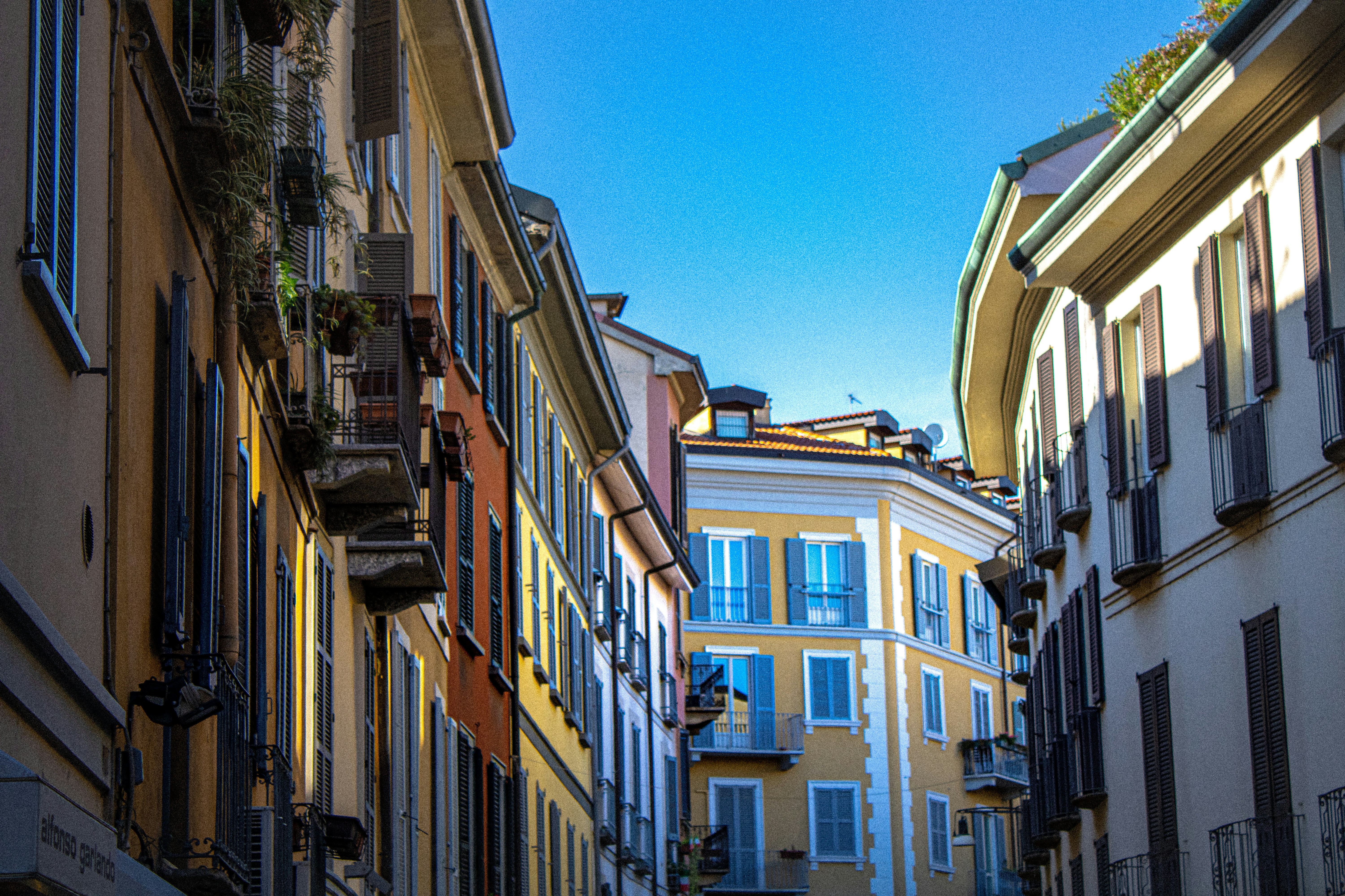 brown and white concrete buildings under blue sky during daytime