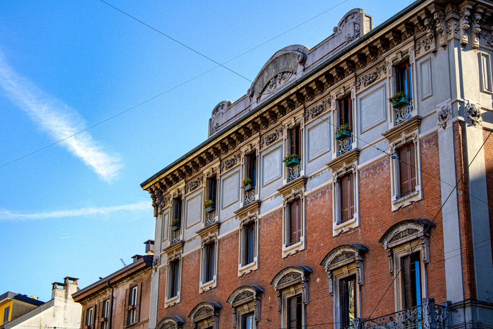 brown concrete building under blue sky during daytime