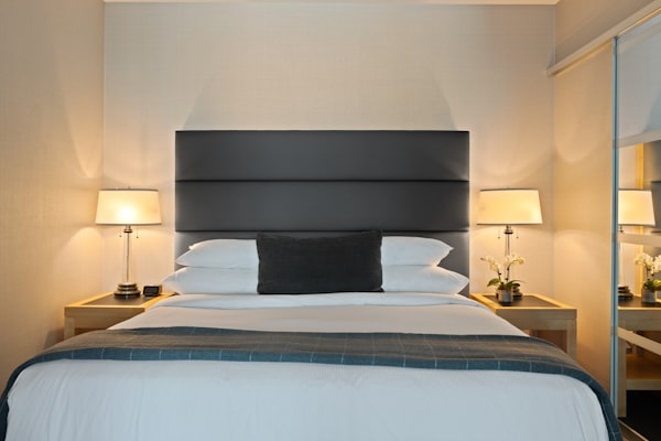 simple bedroom - blue bed runners - minimalist lampshades
