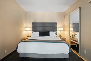 white bed linen on bed