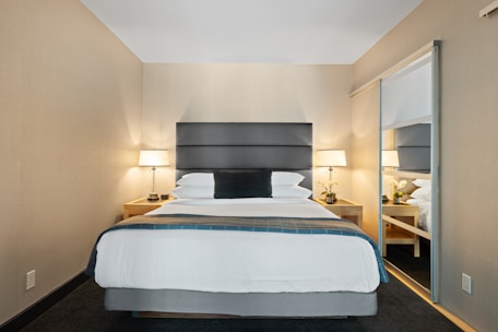white bed linen on bed