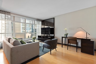gray sectional couch beside brown wooden table