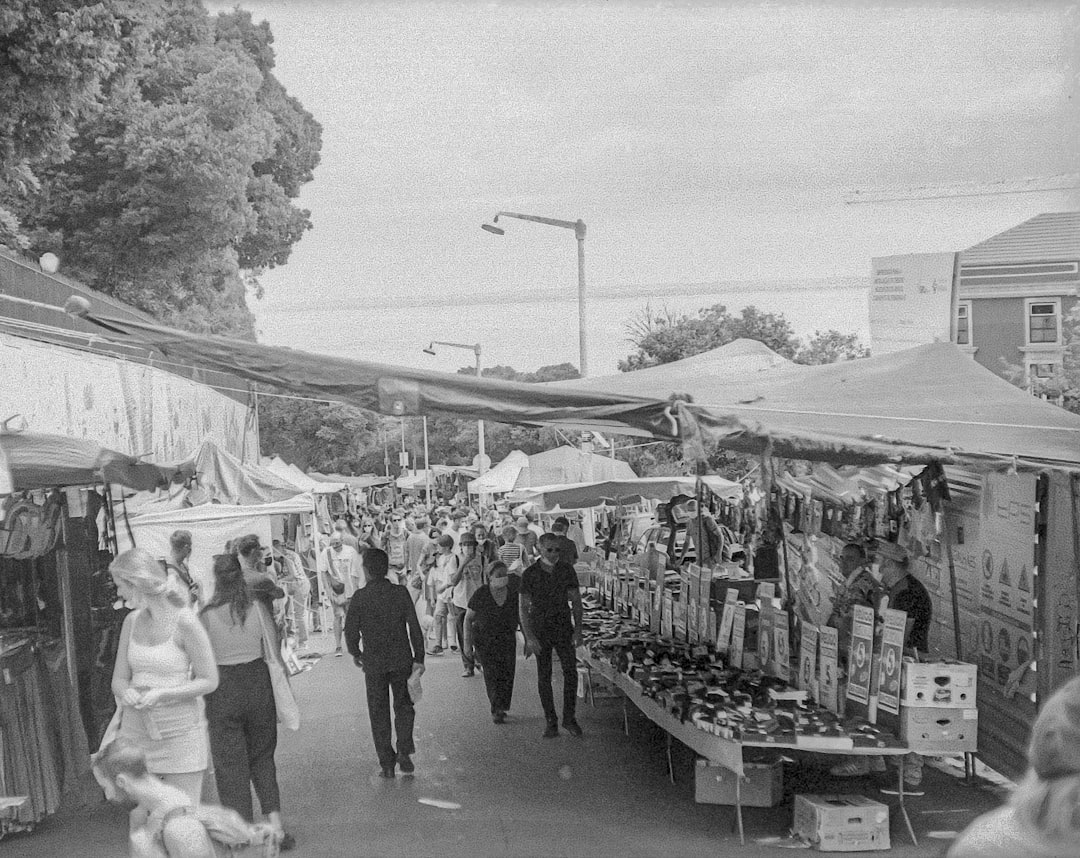 grayscale photo of people walking on street