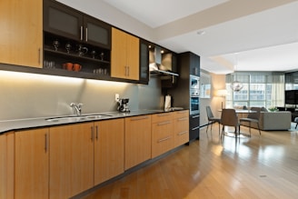 brown wooden kitchen cabinet and sink