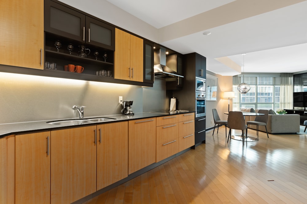 brown wooden kitchen cabinet and sink