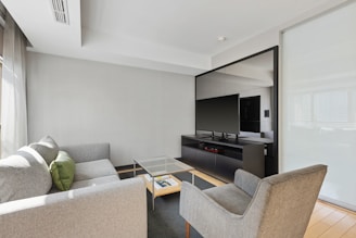 black flat screen tv on black tv rack