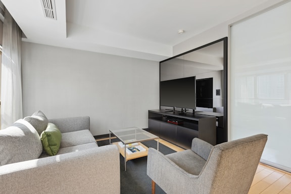 black flat screen tv on black tv rack