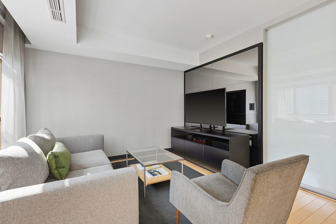 black flat screen tv on black tv rack,