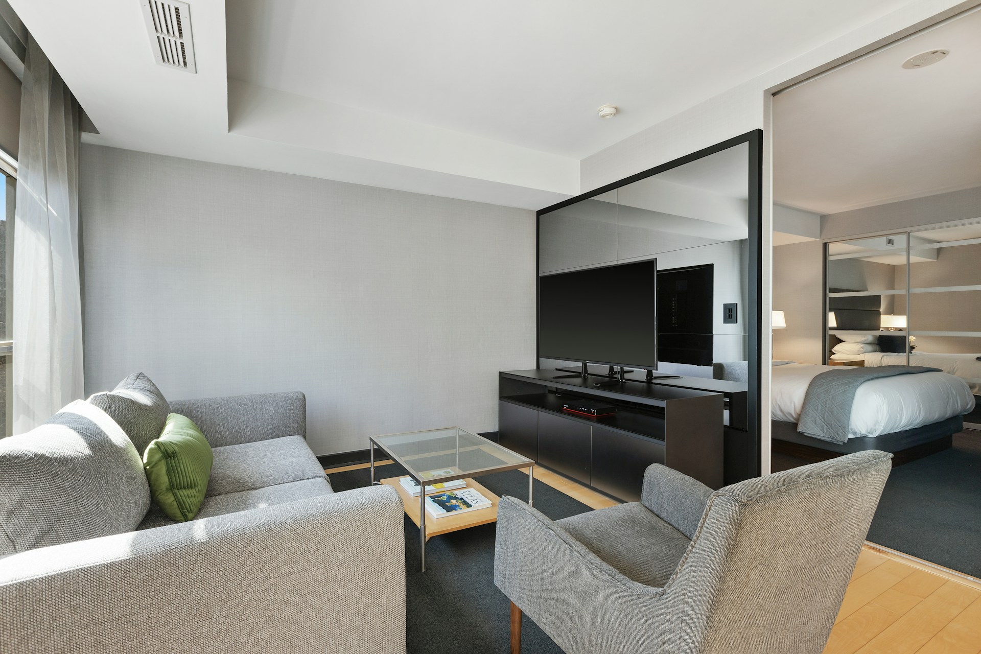 black flat screen tv on black tv rack