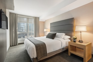 white bed linen on bed