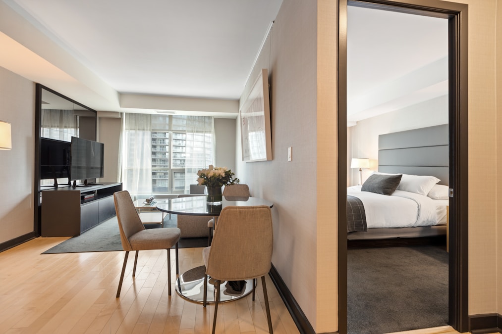 Negative space, the gaps between furniture, reads as expensive. Crowded floor plans read as cheap.